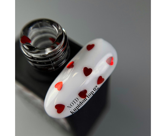 Изображение 2 Nails of the Day Kupidon top 02 - нежное финишное покрытие для ногтей с элегантно бордовыми сердечками, без липкого слоя, 10 мл, Объем (мл, г): 10, Цвет: 02